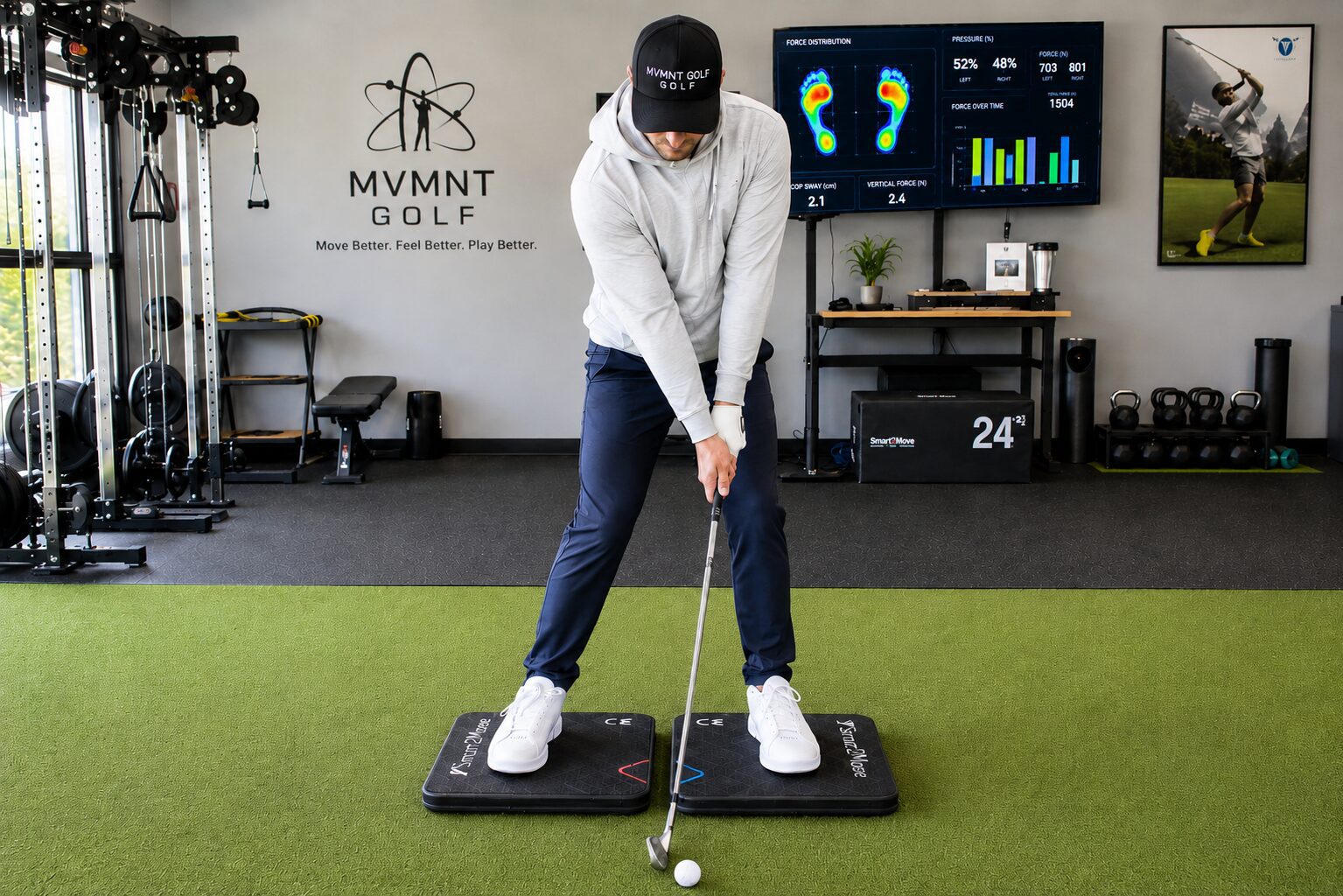 Golfer practicing indoor swing on training mats